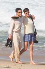 EMMA CORRIN and Rami Malek Out on Ipanema Beach in Rio de Janeiro 07/14/2024