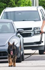 GISELE BUNDCHEN Enjoys an Early Morning Bike Ride in Miami Beach 07/30/2024
