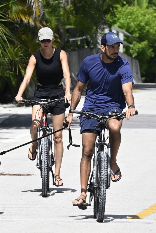 GISELE BUNDCHEN nad Joaquim Valente Riding Bikes Out in Miami 07/14/2024
