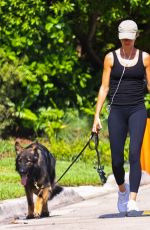 GISELE BUNDCHEN Out Walking Her Dogs in Miami 07/13/2024