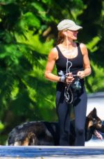 GISELE BUNDCHEN Out Walking Her Dogs in Miami 07/13/2024