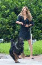 GISELE BUNDCHEN Out with Her Dog in Miami 07/12/2024