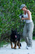 GISELE BUNDCHEN Walks Her Out Dog in Miami 07/01/2024