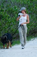 GISELE BUNDCHEN Walks Her Out Dog in Miami 07/01/2024