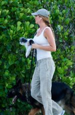 GISELE BUNDCHEN Walks Her Out Dog in Miami 07/01/2024
