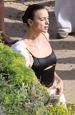 IRINA SHAYK at a Beach Photoshoot in Malibu 07/10/2024