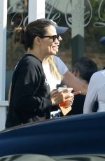 JENNIFER GARNER Enjoys an Iced Tea on a Morning Walk with a Friend in Los Angeles 07/26/2024