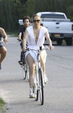 JENNIFER LOPEZ on a bike Ride with Benny Medina and her son Max in New York 07/18/2024
