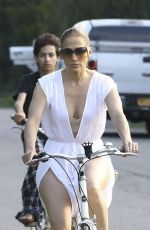 JENNIFER LOPEZ on a bike Ride with Benny Medina and her son Max in New York 07/18/2024