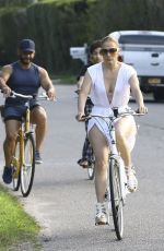 JENNIFER LOPEZ on a bike Ride with Benny Medina and her son Max in New York 07/18/2024