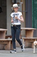 JULIANNA MARGUILES Out with Her Dog for Coffee in New York 07/15/2024