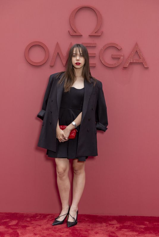 KIM HIGELIN at Opening Night of Omega House in Paris 07/27/2024