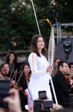 LAETITIA CASTA at 2024 Paris Olympic Games Torch Relayat Saint-Denis 07/26/2024