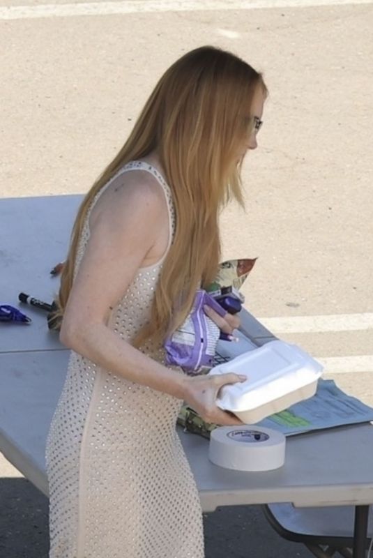 LINDSAY LOHAN Taking a Break on the Set of Freaky Friday in Los Angeles 07/15/2024