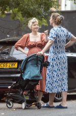 Pregnant KATE PHILLIPS Chatted to a Pal in London 07/20/2024