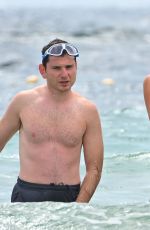 Pregnant MADIOSN HEADRICK in Swimsuit and Joe Nahmad on the Beach in St Tropez 07/21/2024