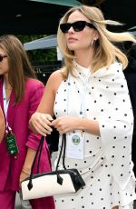 Pregnant MARGOT ROBBIE Arrives at Wimbledon in London 07/12/2024