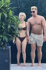 SANDY AOUAD in Bikini and Joey Sint at Rooftop Pool in Los Angeles 07/24/2024