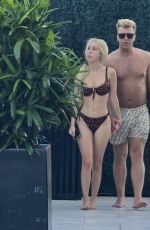 SANDY AOUAD in Bikini and Joey Sint at Rooftop Pool in Los Angeles 07/24/2024