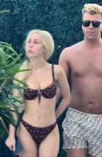 SANDY AOUAD in Bikini and Joey Sint at Rooftop Pool in Los Angeles 07/24/2024