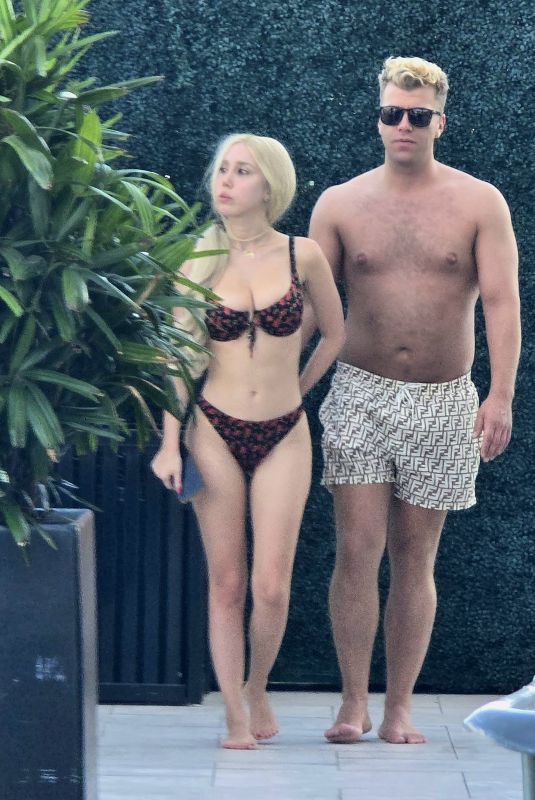 SANDY AOUAD in Bikini and Joey Sint at Rooftop Pool in Los Angeles 07/24/2024