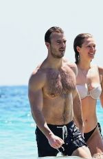 TONI GARRN and Joshua Phitoussi in Bikini at a Beach in St. Tropez 07/20/2024
