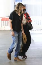 ZOE SALDANA and Marco Perego Zoe Arrives at Airport in Los Angeles 07/29/2024