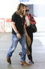 ZOE SALDANA and Marco Perego Zoe Arrives at Airport in Los Angeles 07/29/2024