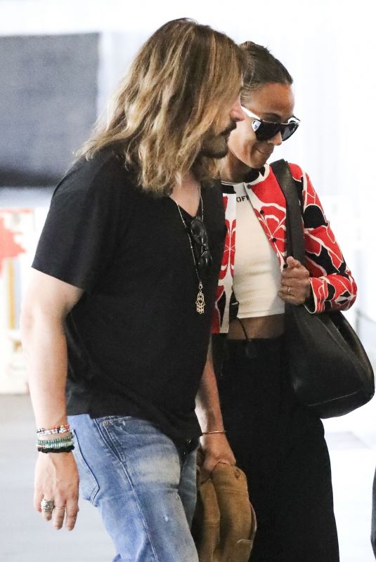 ZOE SALDANA and Marco Perego Zoe Arrives at Airport in Los Angeles 07/29/2024