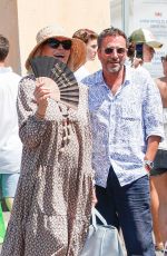 AMANDA LEAR and Bernard Montiel Leaves Le Senequier in Saint Tropez 08/03/2024