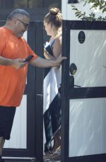 BRITTANY CATWRIGHT Greeting Uber Eats Delivery in Bikini in Los Angeles 08/27/2024