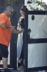 BRITTANY CATWRIGHT Greeting Uber Eats Delivery in Bikini in Los Angeles 08/27/2024