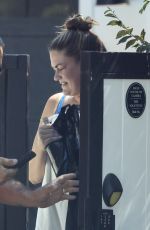BRITTANY CATWRIGHT Greeting Uber Eats Delivery in Bikini in Los Angeles 08/27/2024