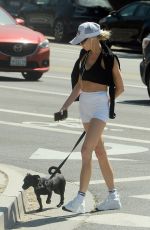 CHARLOTTE MCKINNEY Out with Her Dog in Los Angeles 07/28/2024