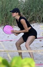 GISELE BUNDCHEN Plays Beach Tennis with a Friend in Miami 08/21/2024