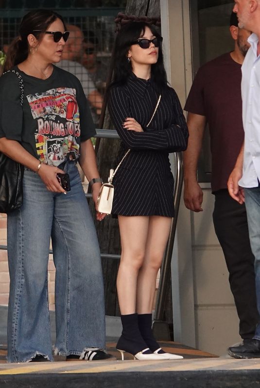 JENNA ORTEGA Catches a Taxi Boat with Her Family in Venice 08/27/2024