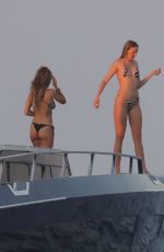 KATE and LILA GRACE MOSS and RITA ORA in Bikinis Out in Formentera 08/04/2024