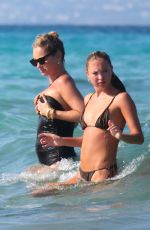 KATE and LILA GRACE MOSS in Bikinis at a Beach In Ibiza 08/07/2024