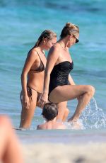 KATE and LILA GRACE MOSS in Bikinis at a Beach In Ibiza 08/07/2024