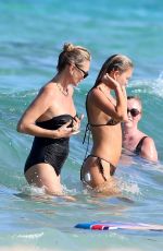 KATE and LILA GRACE MOSS in Bikinis at a Beach In Ibiza 08/07/2024