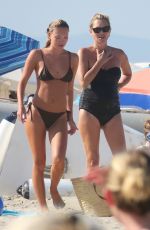 KATE and LILA GRACE MOSS in Bikinis at a Beach In Ibiza 08/07/2024