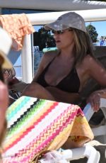 KATE FERDINAND in Bikini at a Beach in Almancil 08/12/2024