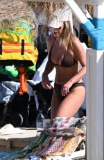 KATE FERDINAND in Bikini at a Beach in Almancil 08/12/2024