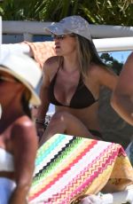 KATE FERDINAND in Bikini at a Beach in Almancil 08/12/2024