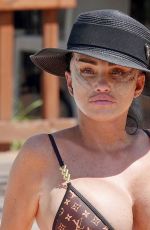 KATIE PRICE in a Louis Vuitton Bikini Showing Her Geavily Bandaged Bruised Face Out in Turkey 08/04/2024