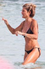 LAURA RAVETTO in Bikini at Club 55 in Saint Tropez 08/18/2024