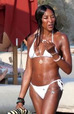 NAOMI CAMPBELL in Bikini at a Beach in Mykonos 08/23/2024