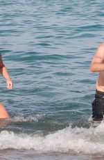 PHOEBE TOMLINSON in Swimsuit at Club 55 in Saint Tropez 08/26/2024