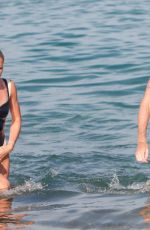 PHOEBE TOMLINSON in Swimsuit at Club 55 in Saint Tropez 08/26/2024