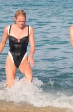PHOEBE TOMLINSON in Swimsuit at Club 55 in Saint Tropez 08/26/2024